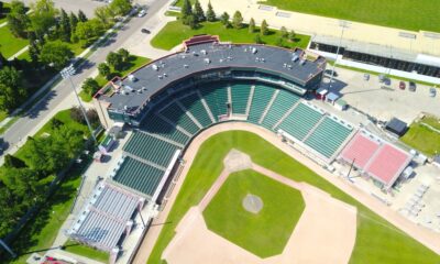 Aerial view of an empty baseball stadium surrounded by trees