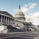 United States Capitol building with its dome and columns beneath a blue sky
