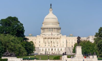 United States Capitol building beneath a blue sky