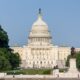 United States Capitol building beneath a blue sky