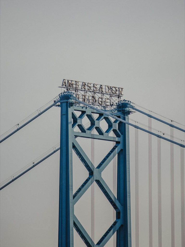 Blue steel structure of the Ambassador Bridge viewed from below